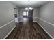 Dining room with new wood flooring, chair-rail molding, and modern lighting at 3763 Waldrop Hills Dr, Decatur, GA 30034