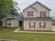 Charming two-story home with red shutters and a well-maintained front yard at 3763 Waldrop Hills Dr, Decatur, GA 30034