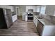 Modern kitchen featuring stainless steel appliances, granite countertops, and white cabinets at 3763 Waldrop Hills Dr, Decatur, GA 30034