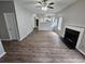 Spacious living room featuring wood floors, a fireplace, and an open view to the kitchen at 3763 Waldrop Hills Dr, Decatur, GA 30034