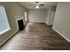 Open living room with wood floors, a fireplace, and plenty of natural light from large windows at 3763 Waldrop Hills Dr, Decatur, GA 30034