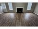 Spacious living room with wood floors, fireplace, and large windows that provide ample natural light at 3763 Waldrop Hills Dr, Decatur, GA 30034