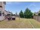 Expansive backyard featuring lush lawn, mature trees, and a charming patio area for outdoor enjoyment at 4560 Evandale Way, Cumming, GA 30040