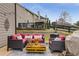 Cozy backyard patio with stylish outdoor seating and a unique pallet coffee table, ideal for relaxation at 4560 Evandale Way, Cumming, GA 30040