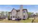 Large backyard with a patio area perfect for entertaining, and lush green lawn for outdoor activities at 4560 Evandale Way, Cumming, GA 30040