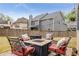 Outdoor patio with comfortable seating arranged around a fire pit, perfect for relaxing and entertaining at 4560 Evandale Way, Cumming, GA 30040