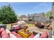 Outdoor patio with comfortable seating, perfect for entertaining, with lush green yard at 4560 Evandale Way, Cumming, GA 30040
