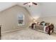 Bedroom features carpeted floors, vaulted ceilings, and a cozy day bed by the window at 4560 Evandale Way, Cumming, GA 30040