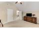 Bedroom with vaulted ceilings, carpeted floors, and a view of the staircase at 4560 Evandale Way, Cumming, GA 30040