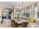 Breakfast nook featuring a large window with charming decor and comfortable banquette seating at 4560 Evandale Way, Cumming, GA 30040