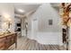 Inviting entryway showcasing elegant wainscoting, archways, and wood-look floors, flowing seamlessly into the home's living spaces at 4560 Evandale Way, Cumming, GA 30040