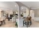 Open concept kitchen with modern appliances, granite counters, bar seating, and hardwood floors at 4560 Evandale Way, Cumming, GA 30040