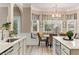 Open kitchen with granite counters, stainless appliances, banquette seating and eat in kitchen at 4560 Evandale Way, Cumming, GA 30040