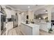 Spacious kitchen with stainless steel appliances, granite countertops, and breakfast bar at 4560 Evandale Way, Cumming, GA 30040