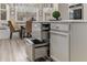 Modern kitchen with stainless steel refrigerator drawers and eat-in breakfast nook with banquette seating at 4560 Evandale Way, Cumming, GA 30040