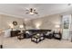 Spacious living room with neutral colors, hardwood floors, and comfortable seating area at 4560 Evandale Way, Cumming, GA 30040