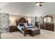 Spacious main bedroom with vaulted ceiling, ceiling fan, and sitting area at 4560 Evandale Way, Cumming, GA 30040