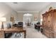 Spacious home office with wood floors, wainscoting and access to formal dining room at 4560 Evandale Way, Cumming, GA 30040