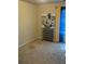 Neutral-colored bedroom with a view of an abstract painting, a shoe rack, and blue curtains at 6311 Olmadison Pl, Atlanta, GA 30349