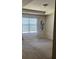 Spacious carpeted bedroom with large window and sheer curtains, filled with natural light at 6311 Olmadison Pl, Atlanta, GA 30349