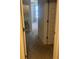 Hallway leading to bedroom with neutral walls and carpeted flooring at 6311 Olmadison Pl, Atlanta, GA 30349
