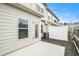 Outdoor patio area featuring a concrete slab, privacy fence, and siding, creating a cozy backyard retreat at 7701 Haynes Park Pl, Lithonia, GA 30038