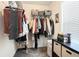 Functional closet with ample hanging space, shelving, and a small window for natural light at 7701 Haynes Park Pl, Lithonia, GA 30038