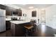 Modern kitchen featuring granite countertops, stainless appliances, and a breakfast bar at 7701 Haynes Park Pl, Lithonia, GA 30038