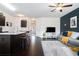 Spacious open concept living room, kitchen with breakfast bar and hardwood floors at 7701 Haynes Park Pl, Lithonia, GA 30038