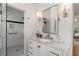 Modern bathroom showcasing a glass-enclosed shower with a built-in bench, marble countertop, and stylish fixtures at 1503 Emory Ne Rd, Atlanta, GA 30306