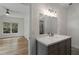 Bathroom featuring a gray vanity, large mirror, with a connecting bedroom at 1503 Emory Ne Rd, Atlanta, GA 30306