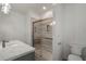 Bathroom with a modern glass shower and sleek fixtures, complementing the marble vanity and bright lighting at 1503 Emory Ne Rd, Atlanta, GA 30306