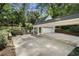 Driveway of a home featuring a portico leading to the garage, complemented by a landscaped pathway at 1503 Emory Ne Rd, Atlanta, GA 30306