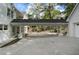 Expansive driveway with portico connecting to the main house and garage, surrounded by lush greenery at 1503 Emory Ne Rd, Atlanta, GA 30306