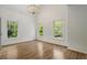 An empty room with great natural light from three large windows and gorgeous hardwood floors at 1503 Emory Ne Rd, Atlanta, GA 30306