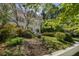 Well-maintained two story home with manicured landscaping and mature trees at 1503 Emory Ne Rd, Atlanta, GA 30306