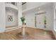 Bright foyer with hardwood floors, white walls, and view of the staircase at 1503 Emory Ne Rd, Atlanta, GA 30306