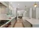 Open kitchen with stainless steel appliances, stone countertops, and a view into the breakfast area at 1503 Emory Ne Rd, Atlanta, GA 30306