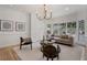 Bright living room featuring hardwood floors, modern furnishings, and large windows for natural light at 1503 Emory Ne Rd, Atlanta, GA 30306