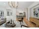 Spacious living room connecting to the kitchen, featuring modern decor and hardwood floors at 1503 Emory Ne Rd, Atlanta, GA 30306