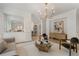 Living room with hardwood floors, chandelier, and view into the kitchen at 1503 Emory Ne Rd, Atlanta, GA 30306