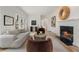 Elegant living room featuring a fireplace, plush seating, and ample natural light at 1503 Emory Ne Rd, Atlanta, GA 30306