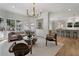 Spacious living room open to the kitchen area, featuring hardwood floors and modern decor at 1503 Emory Ne Rd, Atlanta, GA 30306