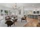 Spacious living room open to the kitchen area, featuring hardwood floors and modern decor at 1503 Emory Ne Rd, Atlanta, GA 30306