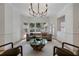 Bright living room featuring hardwood floors, modern furnishings, and large windows at 1503 Emory Ne Rd, Atlanta, GA 30306