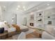 Spacious main bedroom boasts a fireplace, built-in bookshelves and tray ceiling with recessed lighting at 1503 Emory Ne Rd, Atlanta, GA 30306