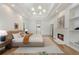 Main bedroom with fireplace, hardwood floors, tray ceiling, and walk-in closet access at 1503 Emory Ne Rd, Atlanta, GA 30306