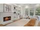Bright main bedroom features a fireplace, built-in shelves and a sitting area with outdoor views at 1503 Emory Ne Rd, Atlanta, GA 30306