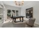 Bright office space with large windows, built-in shelves, and elegant chandelier at 1503 Emory Ne Rd, Atlanta, GA 30306