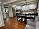 Spacious kitchen featuring white cabinets, stainless steel appliances, and a large center island with seating at 1718 Pucketts Sw Dr, Lilburn, GA 30047